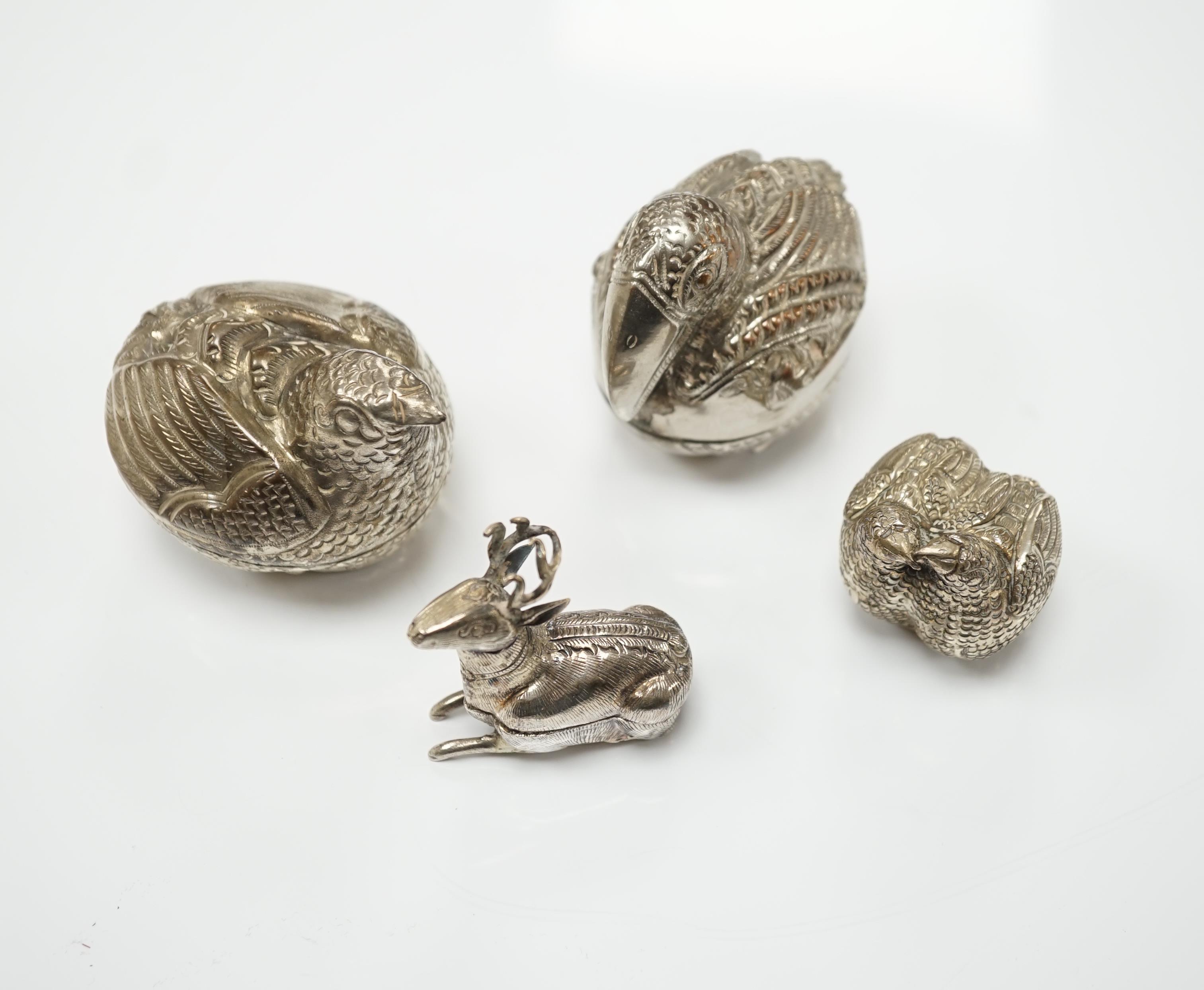 Four South East Asian white metal small ‘animal’ boxes. Largest 6cm